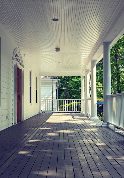 Expert staining for a large front porch on a Walpole mansion
