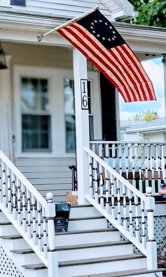 DOC Painting exterior project in the Boston area, showcasing our free flag offer