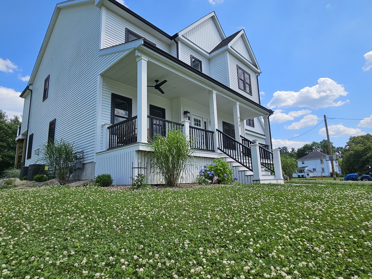 Complete exterior repaint of a classic farmhouse by DOC Painting