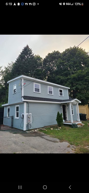 Modern grey exterior paint job on a residential home in the Boston area